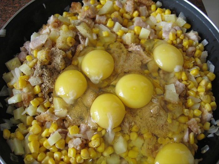 <p> Mix in the eggs, instant soup, salt and pepper and corn or vegetables</p>