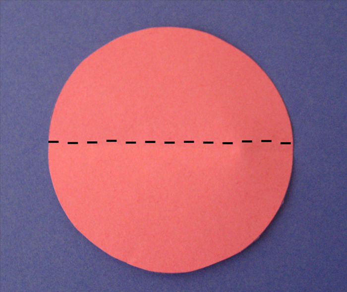 Fold the large circle in half.
Unfold