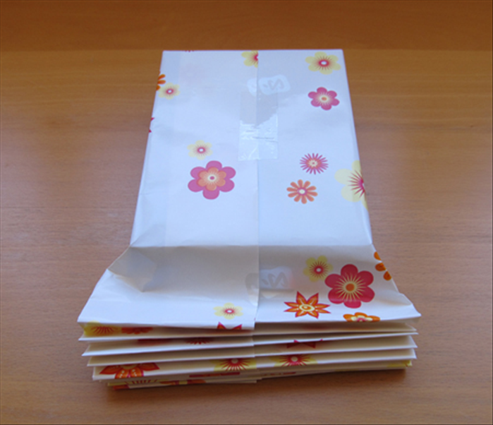 Fold the accordion fold until you have reached the top of the gift.