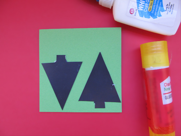 <p> Glue the magnet shapes to green paper.</p> 
<p> When the glue has dried cut out the shapes.</p> 
<p>  </p>
