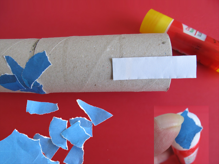 <p> Cut a strip of sturdy paper and glue it to the open edge of the double roll.</p> 
<p> Rip junk mail into small pieces.</p> 
<p> Slide a piece over the top of the glue stick to coat the underside with glue.</p> 
<p> Cover the double roll with overlapping glued pieces.</p> 
<p> *Leave the end of the strip that is sticking out uncovered.</p> 
<p>  </p>