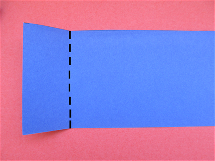 Take the strip of paper you just cut off.
Make a straight fold on the paper. The measurement from the edge to the fold will be the height of your box.
Cut along the fold

