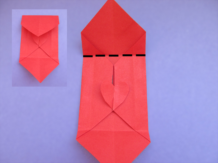 Fold the top point down to the bottom of the heart
Crease and unfold
