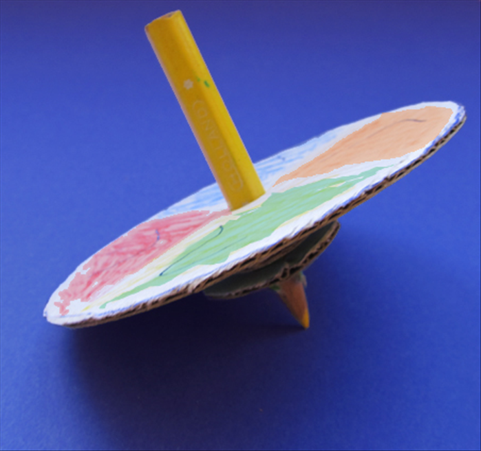When the glue has dried your dreidel is ready to spin.

*The point of the pencil makes a mark so make sure you spin it on a piece of paper or on a surface that it doesn’t matter.

Have fun!
