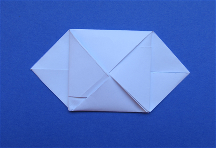 Push it in all the way and repeat for the right top flap

Your letter envelope is finished!


Pull on the side flaps to open it.