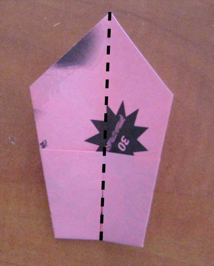 Flip the paper over to the other side and fold in half vertically.