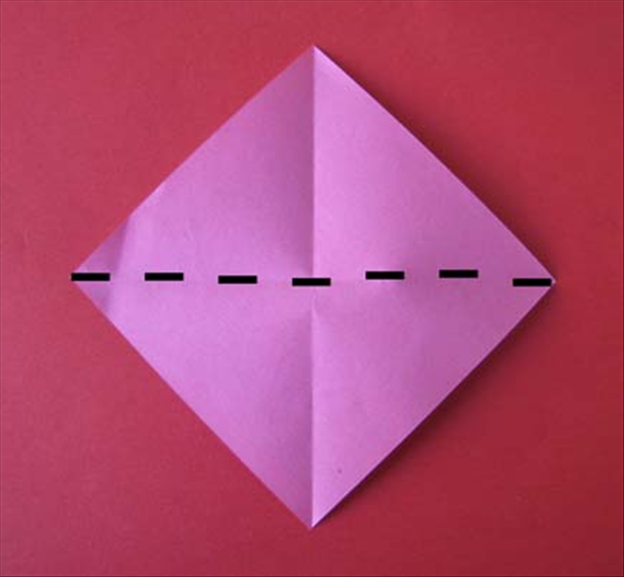Place the paper with the points at the top, bottom and sides.

Fold it in half horizontally. Unfold.
Fold it in half vertically. Unfold.