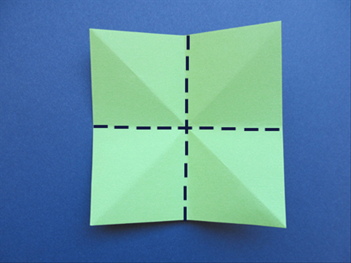 Flip the paper over to the back side with the straight edges on the top, bottom and sides

Fold the bottom edge to the top edge to fold it in half. Unfold
Fold side edges together to fold it in half. Unfold
