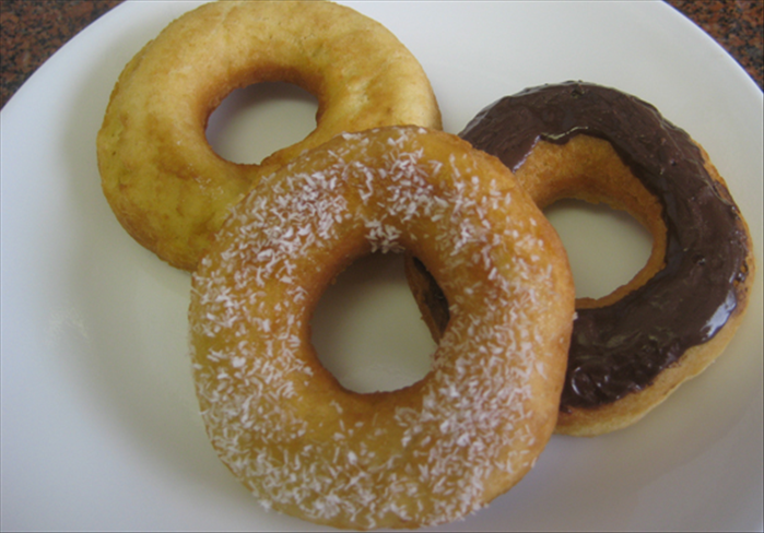 Flip over the doughnuts and fry the other side until light brown .
Place doughnuts on paper towels to absorb someof the oil
Sprinkle with powdered sugar or coat with icing

Bon Appetite!
