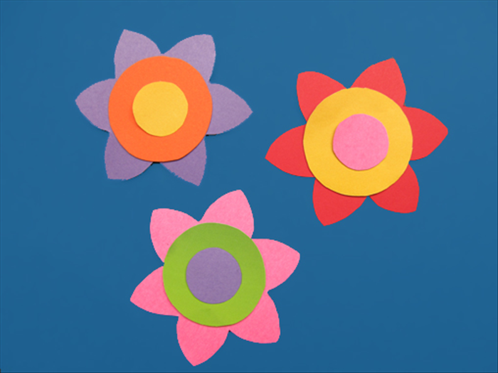 Here are some examples of the flowers with the circles glue to the center.

You can make flowers of different sizes and place them on top of each other with the largest one on the bottom and smallest on top.

 Have fun experimenting and creating!
