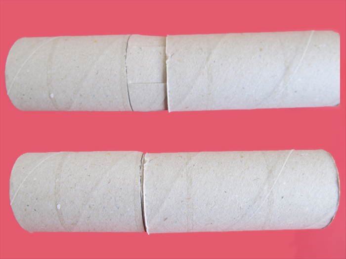 <p> Squeeze the slit edges together and slide them into another toilet paper roll.</p> 
<p> Adjust the rolls so that they meet at the line.</p> 
<p>  </p>