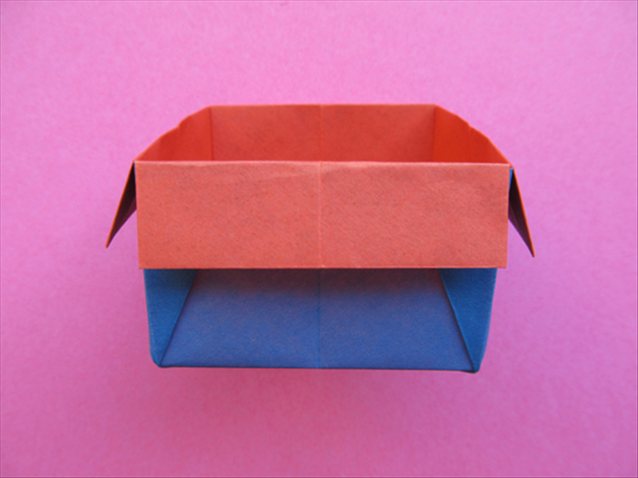 Press down from the top to flatten the bottom and your origami box is finished!