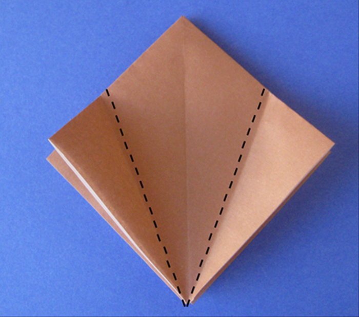 This model begins with the square base.
See the instructions for folding a square base if you do not know how to do it.

Place your square base with open side on the bottom.
Fold the side points up to the center crease.
