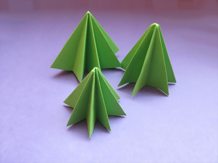 Stand up the Christmas tree with the point on the top and adjust the folds if needed.
Merry Christmas!
