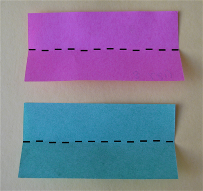 <p> Fold both rectangles in half lengthwise</p>