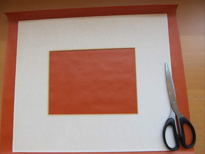 If there is a mat and it is dirty or you just want to change the color:
 
Cut a piece of paper or material big enough to fold over all the outer edges.

