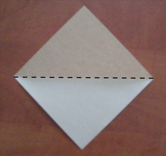 Place the paper with the points on top, bottom and sides.
Fold the paper in half horizontally. Unfold
