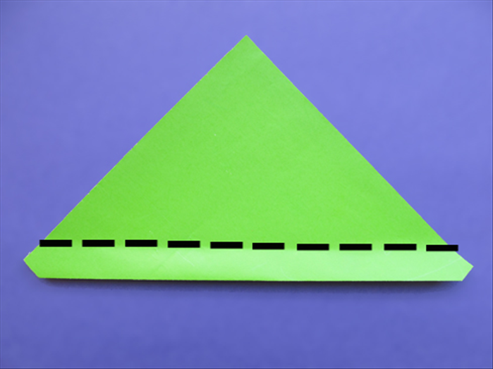 Flip the paper over to the back side
Make a fold slightly above the side points.
See the next picture for the result
