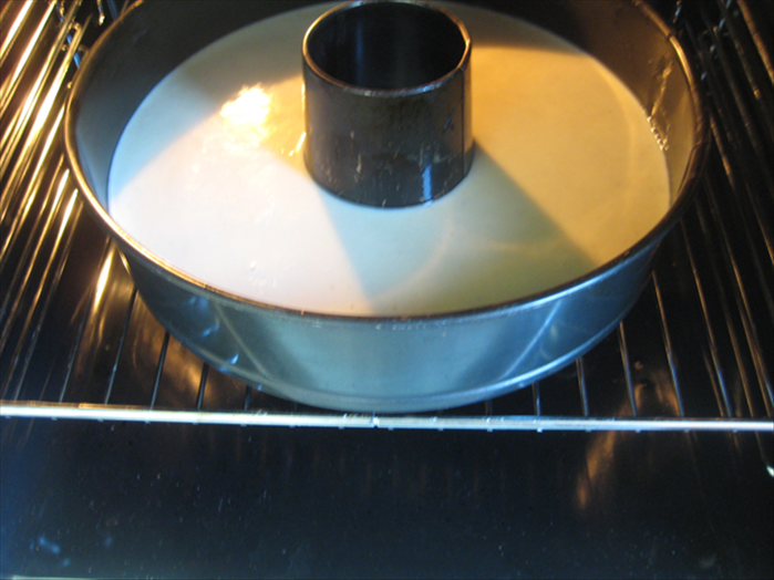 Pour the batter into a tube pan.
 Bake 50-60 mins in a 350 degree F .
 It should be light brown, pull from the sides of the pan and a toothpick comes out clean when inserted