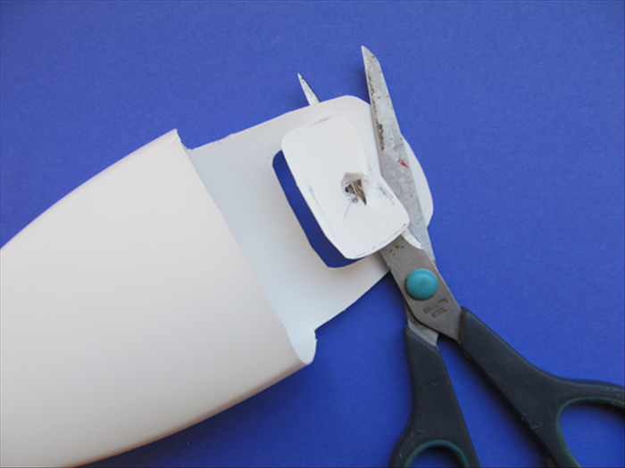 Use the hole as an entrance point for your scissors. Cut a little outside the line you traced.
