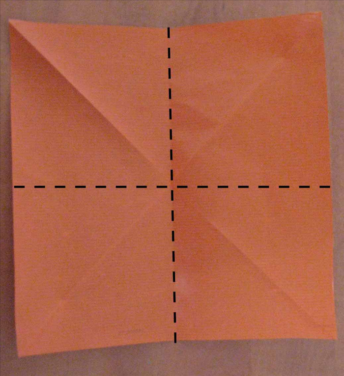 Flip paper over to the back side. 

  Fold in half horizontally and unfold
Fold the paper in half vertically and unfold