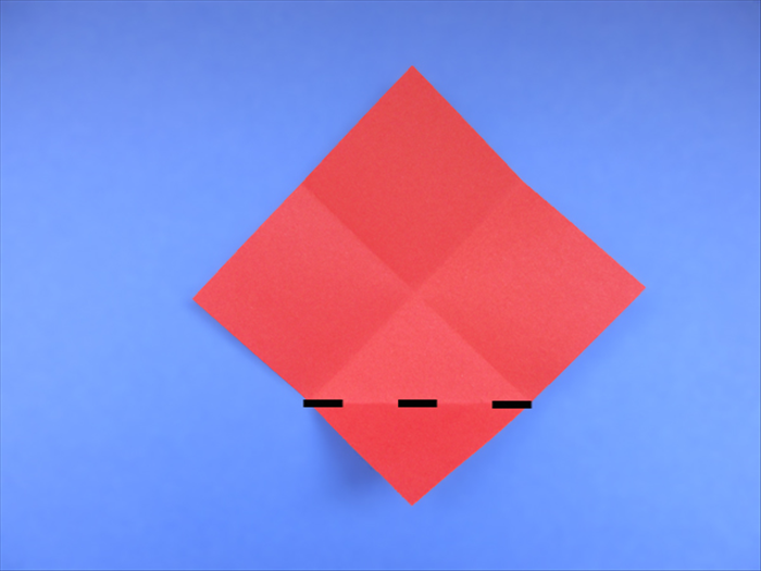 <p> Place the paper with the points at the top, bottom and sides.</p> 
<p> The crease marks make an X.</p> 
<p> Fold the bottom tip up to the center of the X.</p> 
<p>  </p>