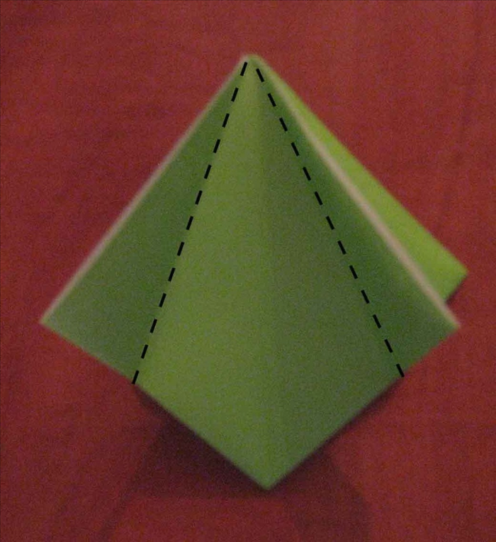 Make sure the open edge of your square base is at the top.

Fold the 2 top sides to align with the center crease.
 Unfold.