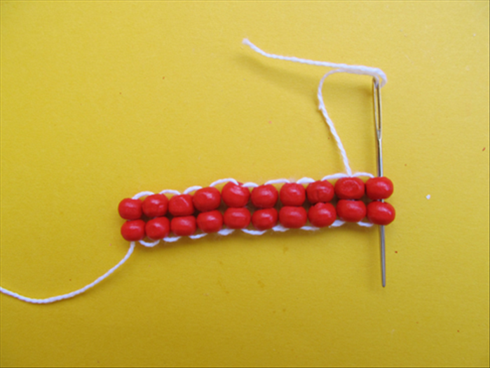 Repeat from step 7 until you have made enough rows to go around you finger


Put the needle through one more time so that the string comes out of the last 2 beads
