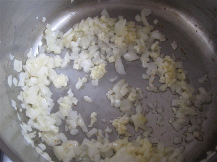 Fry the onions in the 2 tablespoons of oil until translucent

Then add the garlic and fry for 1 minute more
