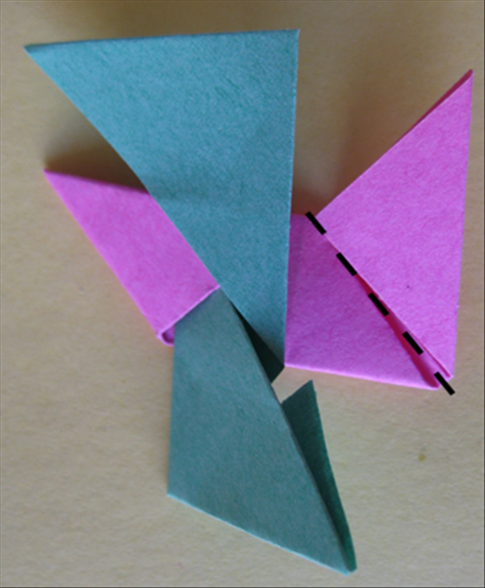 <p> Result Fold the right side down and insert it under the botton flap.</p>