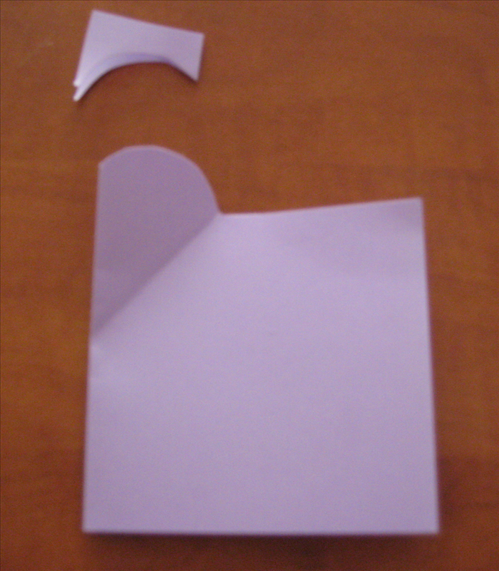 Start at the top of the angle crease point and cut away an arch shape as shown.