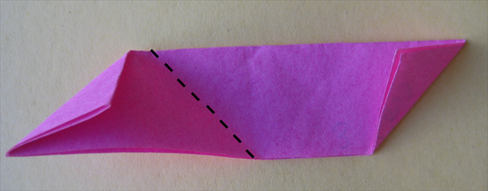 <p> Take the first paper you folded and fold it up from the center crease.</p>