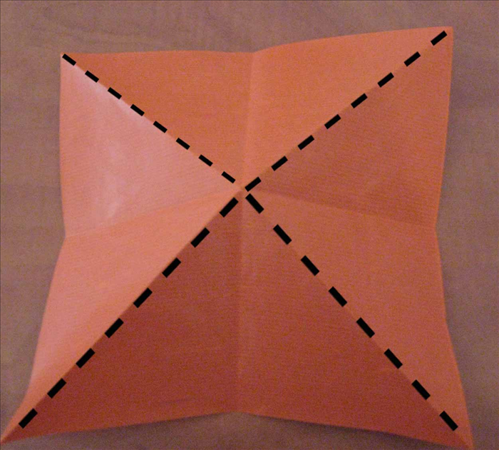 Pinch and squeeze the diagonal folds to make them stick up