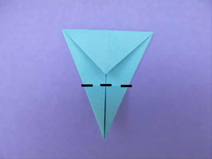 <p> Fold the bottom point up to the top.</p> 
<p>  </p>