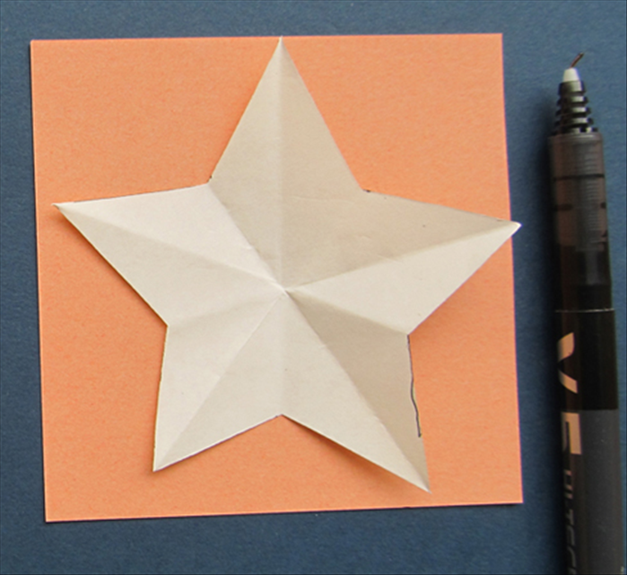 Open the cut papers
Trace the large star 2 times on colored paper.
Trace the small star 2 times on a different colored paper.
