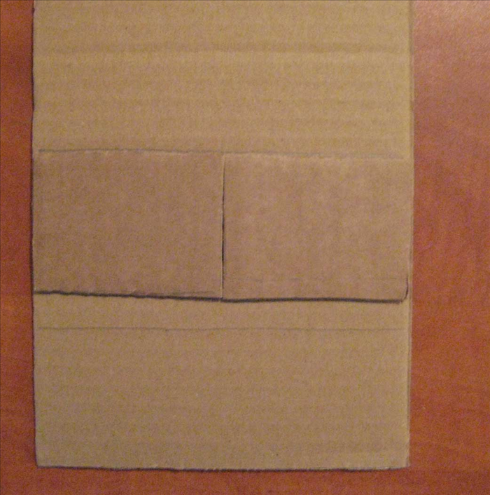 <p> Place the 2 rectangles next to each other with the shorter edged touching to measure and mark the front and back of the box bottom. Use a ruler to draw the shape. Make another for the back piece Cut out the 2 pieces of cardboard.</p>