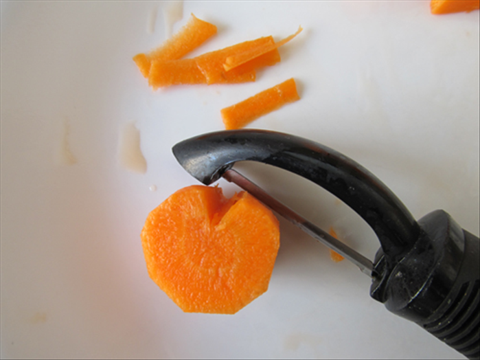 Stroke the vegetable peeler across the top a few times to round it off 