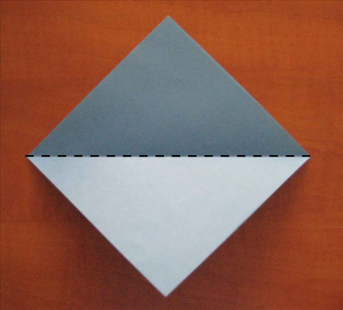 Place the paper with the points at the top, bottom and sides.

Fold it in half horizontally and unfold.

