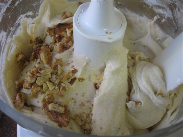 <p> Stir the nuts into the batter by hand</p>