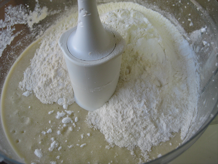 <p> Mix in the flour and baking powder</p>