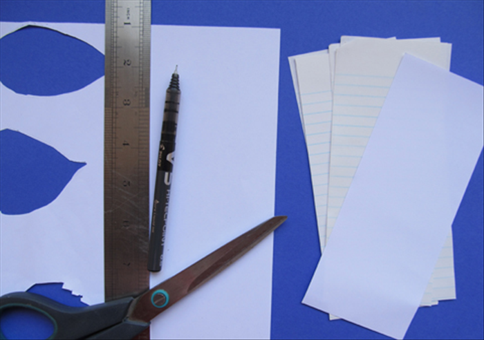 Cut your scrap paper into strips  3 inch wide by 6 inches long.

You can use any length or width you want. Take into account that 1 inch of the paper length will be covered. 