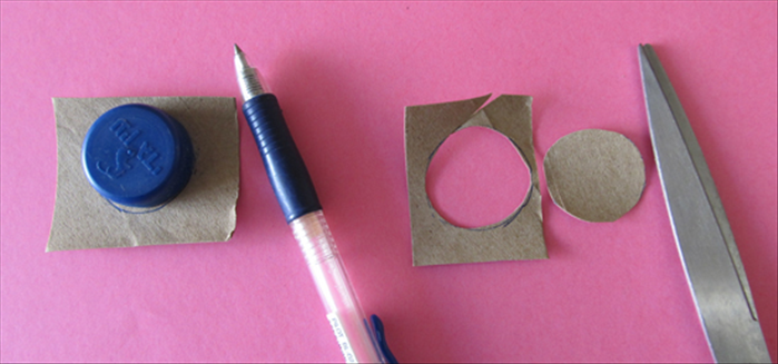 Flatten a leftover piece of  cardboard.
Trace a circle around a bottle cap and cut it out
