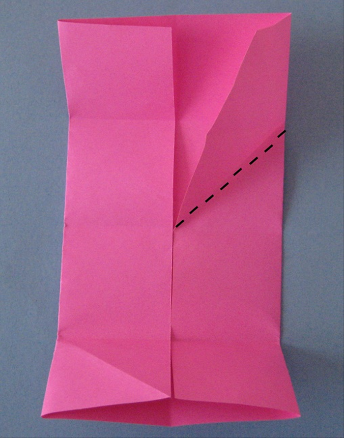 Rotate the paper so that the short ends are at the top and bottom

Bring the right flap down at an angle to align with the center crease.

Do the same with the left flap