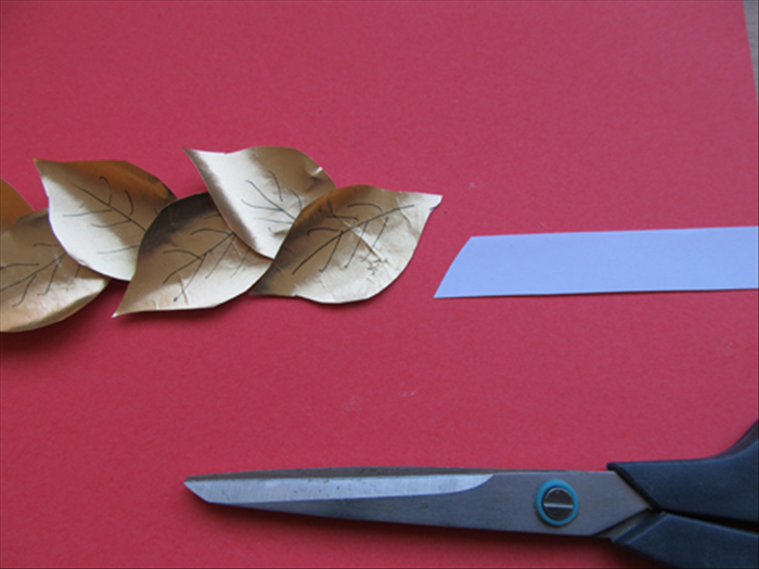 Continue adding leaves after measuring it around your head to see where it reaches the first leaf. 

Cut off the extra a little under the last leaf