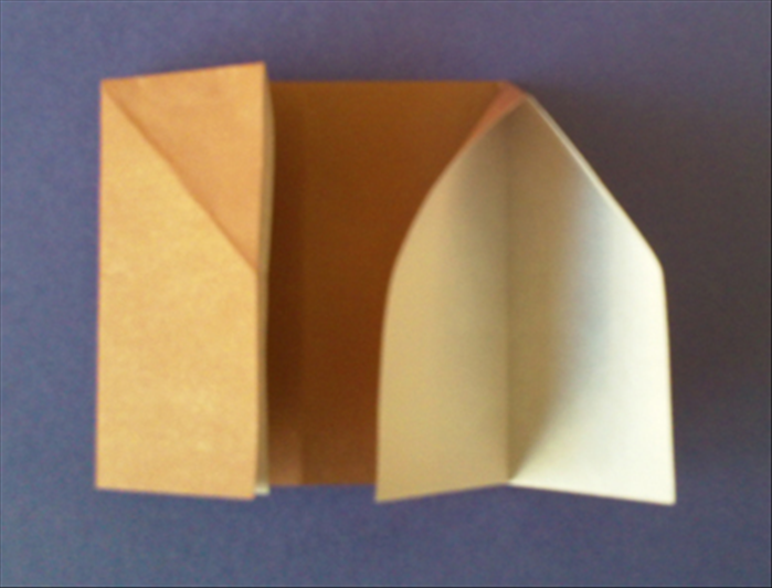 Pull the top layer of the right flap out to the left