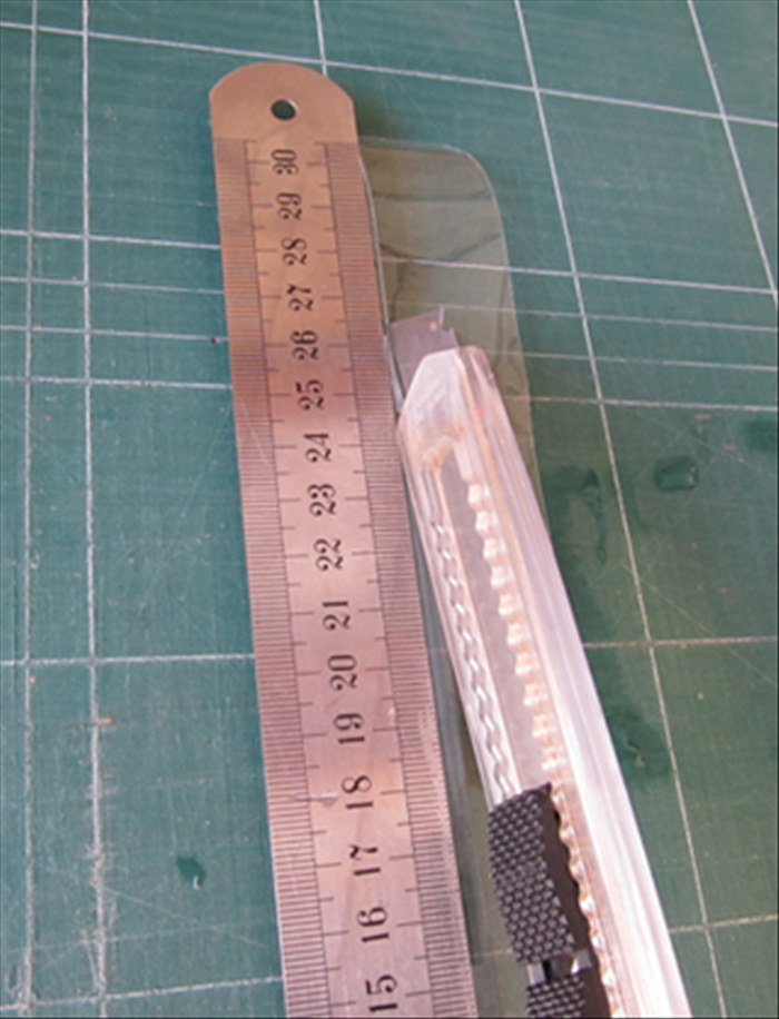 Cut a straight edge on the other side of the ruler.
It should be about 1 1/4 inches wide.

Cut another strip the same way for your second shaker